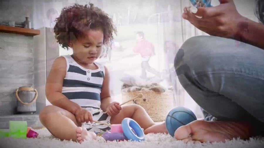 adult playing with toddler