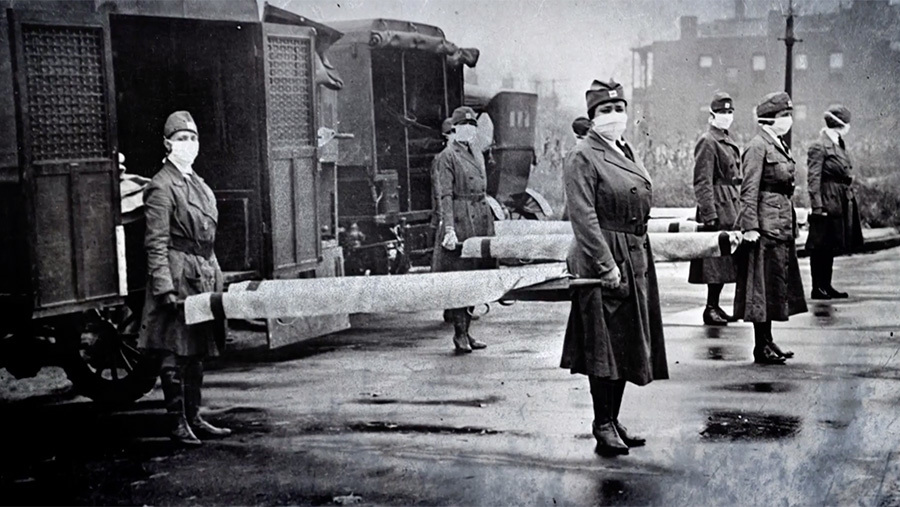 Military women carrying stretchers