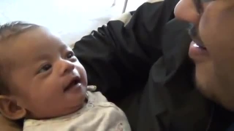 Thumbnail for 1 month old baby copies dad, making face, mimic and laughing