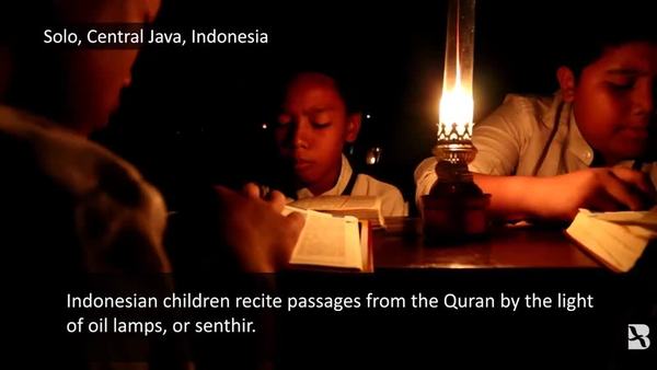 By Oil-Lamp Light, Indonesian Children Recite Quran During Ramadan