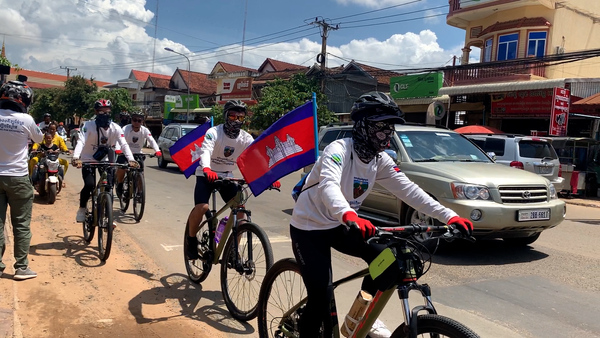 Cambodian environmental activists ride bicycles to protect forests