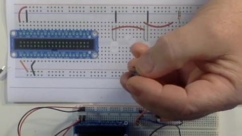 Thumbnail for Switch + 3 LEDs Step: Inserting the Switch Into the Breadboard