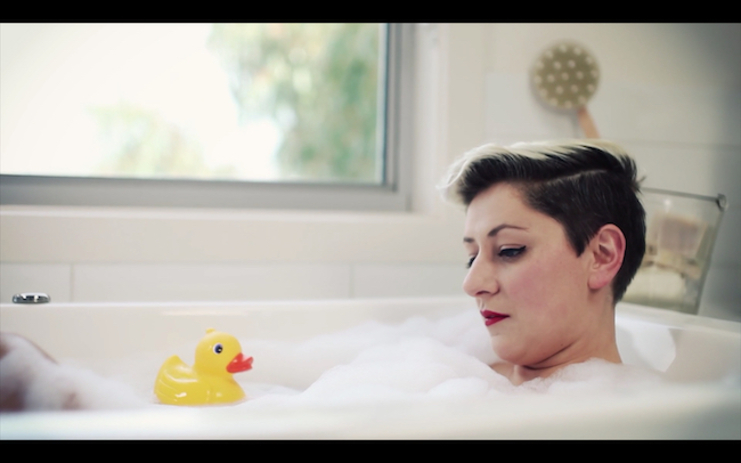 Hamlet (Rowena Hutson) delivering "To be or not to be" in the bath