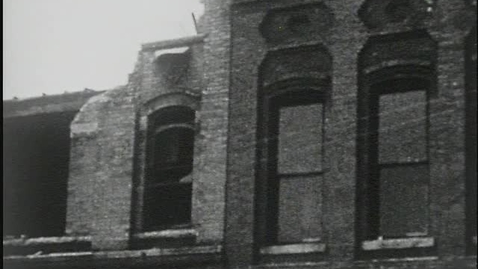 Thumbnail for entry Clip surveying the damage on Washington Street between Darnell’s Dress Shop and George P. Estes Company, Gainesville, Georgia 1936 April 6