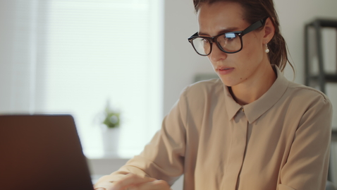 Thumbnail for Businesswoman Typing on Laptop at Desk in Office
