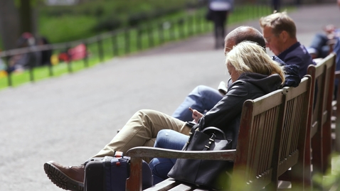 Thumbnail for Woman sitting on a bench in park