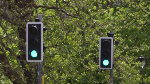 Thumbnail for Traffic lights changing in urban park setting