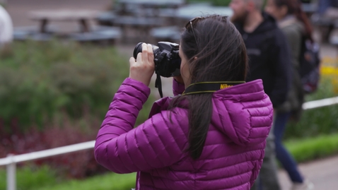 Thumbnail for Photographer in urban park setting