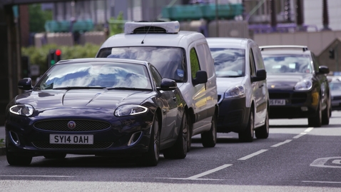 Thumbnail for Luxury car starts on busy city street