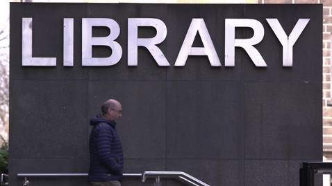 Thumbnail for Library entrance with visitors walking