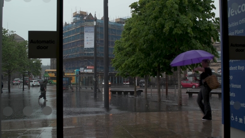 Thumbnail for people walking in heavy rain