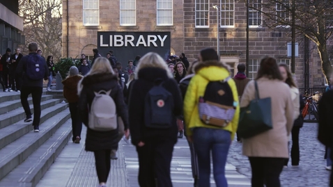 Thumbnail for University campus library with passing students